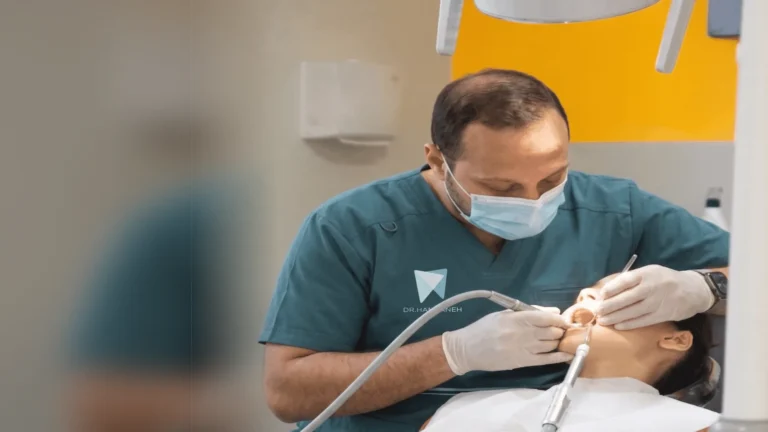 Emergency dentist in Khalda treating a patient at Dr. Khaled Hamarneh Dental Center